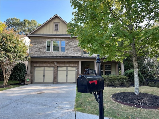 craftsman-style home featuring a front yard and a garage