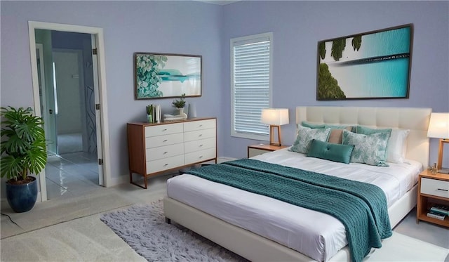bedroom with baseboards and carpet floors