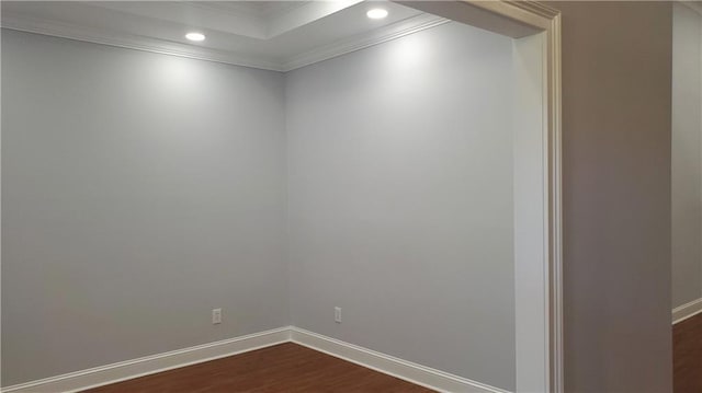 unfurnished room featuring crown molding, recessed lighting, dark wood-style flooring, and baseboards