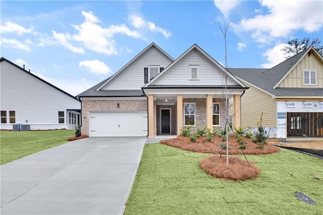 view of front of home featuring concrete driveway, brick siding, a front lawn, and an attached garage