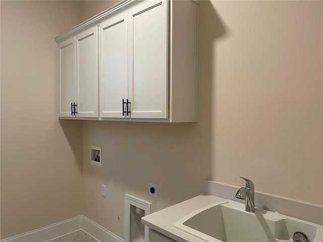 laundry area featuring cabinets, washer hookup, sink, and electric dryer hookup