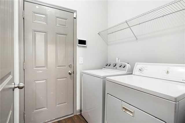 876 Ivydale Ln Unit 63, Lawrenceville, GA 30045 - laundry area featuring washer and dryer and dark wood-type flooring
