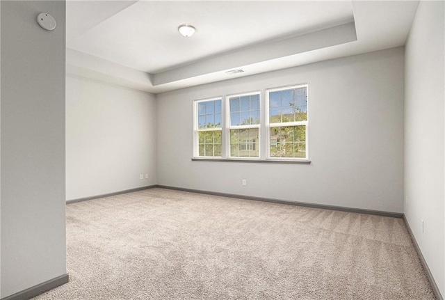 876 Ivydale Ln Unit 63, Lawrenceville, GA 30045 - spare room with carpet flooring, a tray ceiling, and baseboards