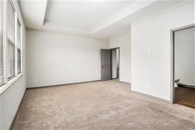 876 Ivydale Ln Unit 63, Lawrenceville, GA 30045 - carpeted empty room featuring baseboards and a tray ceiling