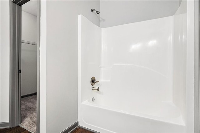 876 Ivydale Ln Unit 63, Lawrenceville, GA 30045 - full bath featuring wood finished floors, bathtub / shower combination, and baseboards