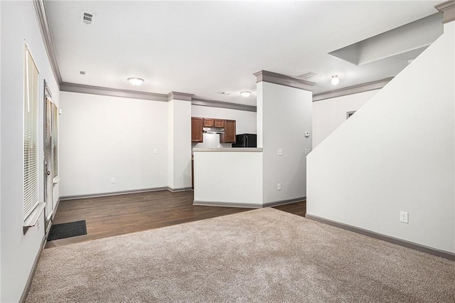 876 Ivydale Ln Unit 63, Lawrenceville, GA 30045 - unfurnished living room featuring dark carpet, crown molding, baseboards, and dark wood-style floors