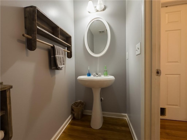 111 Bexley Ln, Douglasville, GA 30134 - bathroom with wood finished floors, baseboards, and a sink