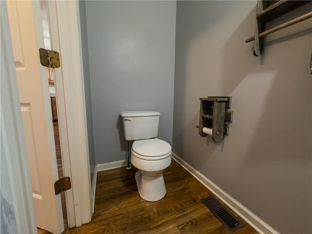 111 Bexley Ln, Douglasville, GA 30134 - bathroom featuring toilet, wood finished floors, and baseboards