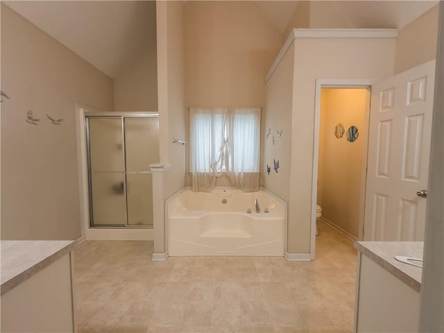 111 Bexley Ln, Douglasville, GA 30134 - bathroom with vanity, lofted ceiling, toilet, a garden tub, and a stall shower
