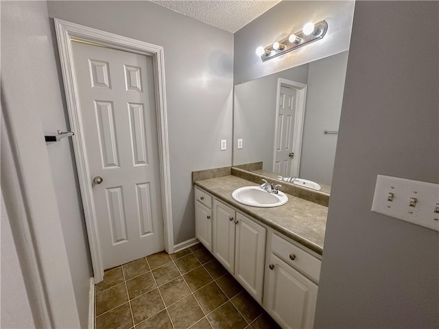 111 Bexley Ln, Douglasville, GA 30134 - bathroom with vanity, a textured ceiling, and tile patterned floors