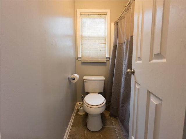 111 Bexley Ln, Douglasville, GA 30134 - bathroom with toilet, tile patterned flooring, and baseboards