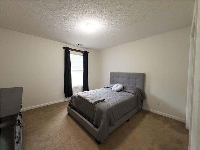 111 Bexley Ln, Douglasville, GA 30134 - carpeted bedroom with a textured ceiling and baseboards