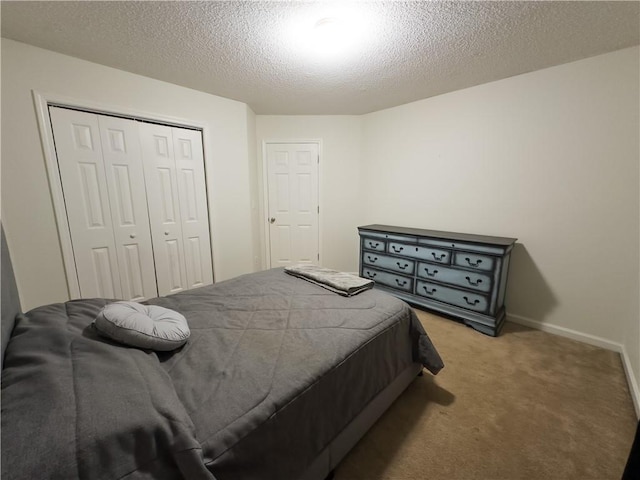 111 Bexley Ln, Douglasville, GA 30134 - bedroom with light colored carpet, a closet, a textured ceiling, and baseboards