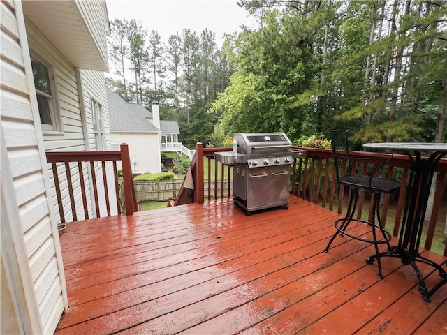 111 Bexley Ln, Douglasville, GA 30134 - deck with a grill and view of wooded area