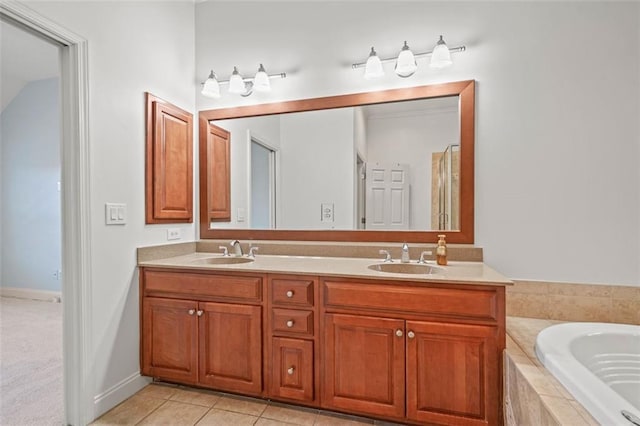 full bathroom featuring double vanity, a sink, a bath, and tile patterned floors