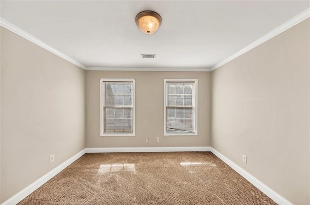 carpeted spare room featuring ornamental molding