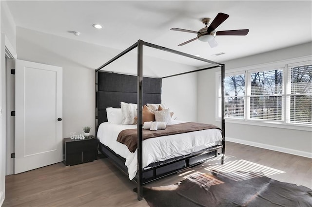 bedroom with wood-type flooring and ceiling fan