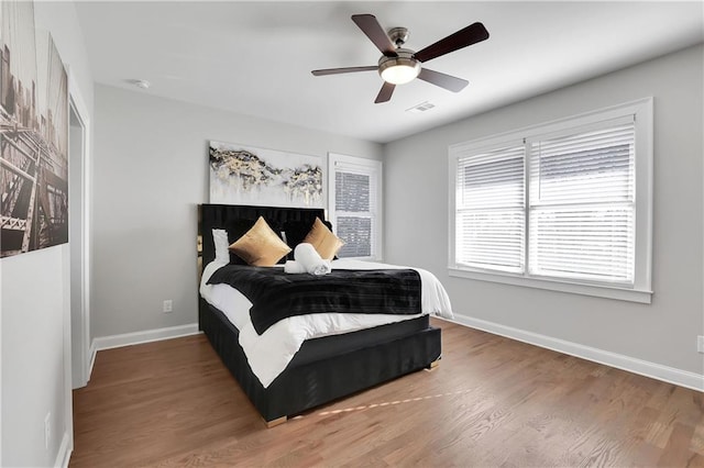 bedroom featuring ceiling fan and wood-type flooring