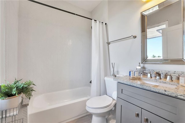 full bathroom featuring shower / bath combination with curtain, vanity with extensive cabinet space, and toilet