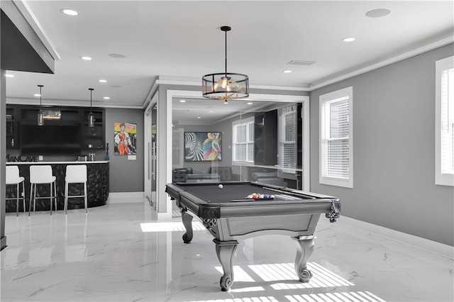 recreation room with plenty of natural light, pool table, light tile floors, and ornamental molding