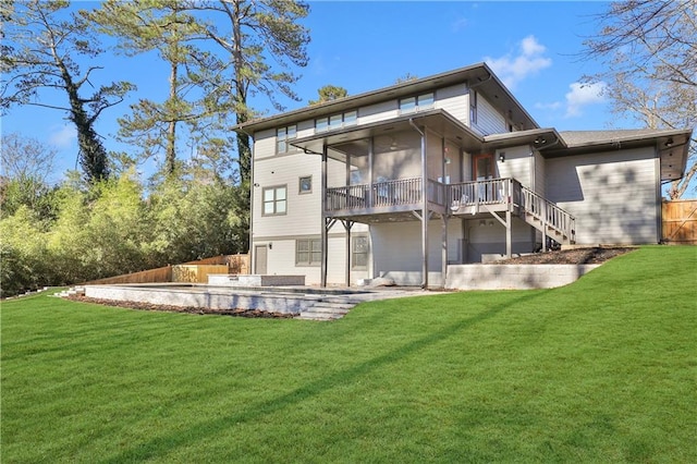 back of property featuring a patio, a sunroom, and a lawn