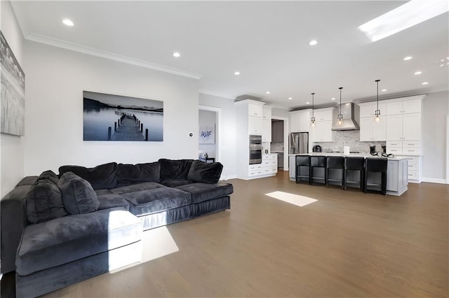 living room featuring dark hardwood / wood-style floors and ornamental molding