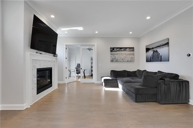 living room featuring crown molding and wood-type flooring