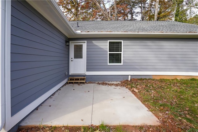 doorway to property with a patio area