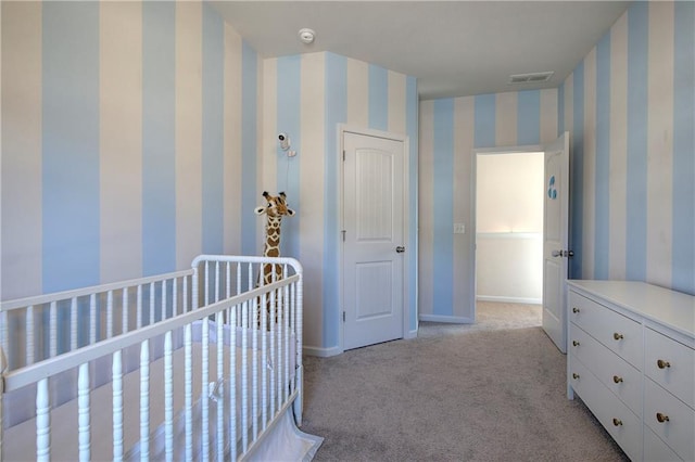 unfurnished bedroom featuring wallpapered walls, visible vents, light colored carpet, and baseboards