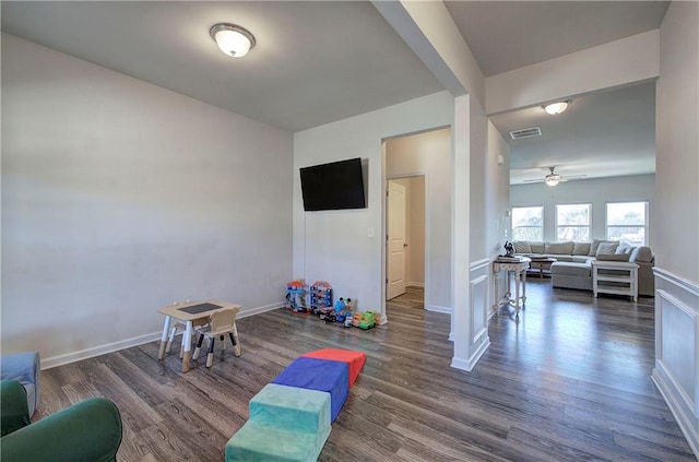 game room featuring wood finished floors, visible vents, and baseboards