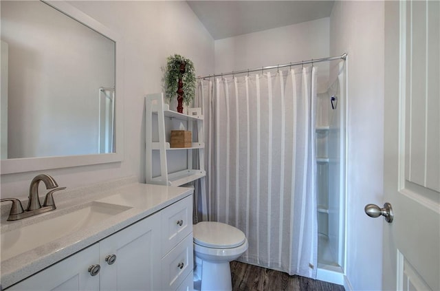 full bath featuring curtained shower, wood finished floors, toilet, and vanity