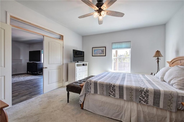 bedroom featuring ceiling fan and carpet