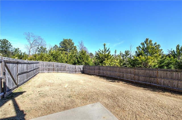 view of yard with a fenced backyard