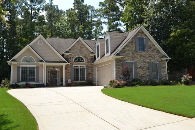 view of front facade with a garage and a front yard