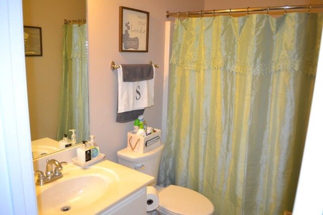 bathroom with vanity and toilet