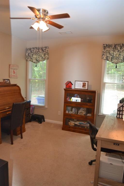 laundry area featuring sink, dark tile patterned floors, and washing machine and clothes dryer