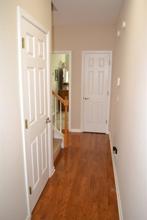 hallway featuring dark hardwood / wood-style flooring