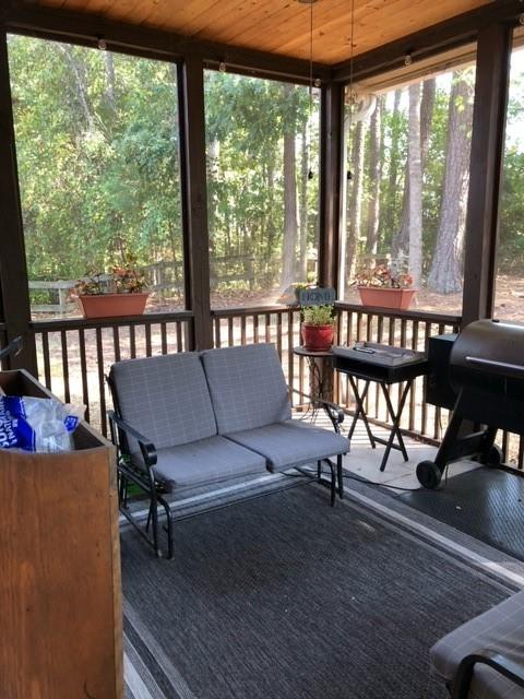 sunroom with wood ceiling