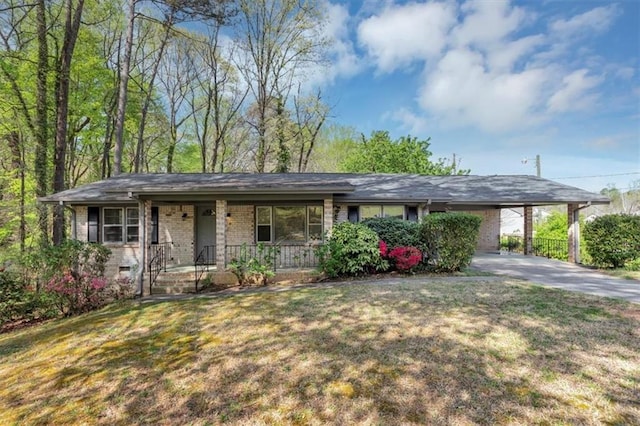 9258 Westview Dr SW, Covington, GA 30014 - single story home with a front lawn, driveway, a carport, and a porch