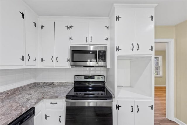 9258 Westview Dr SW, Covington, GA 30014 - kitchen featuring stainless steel appliances, baseboards, decorative backsplash, white cabinets, and wood finished floors