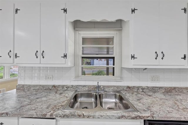 9258 Westview Dr SW, Covington, GA 30014 - kitchen featuring white cabinetry, backsplash, a sink, and dishwasher