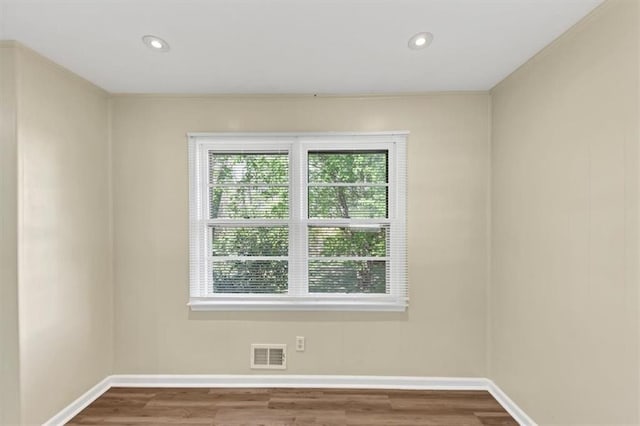 9258 Westview Dr SW, Covington, GA 30014 - unfurnished room with wood finished floors, recessed lighting, baseboards, and visible vents