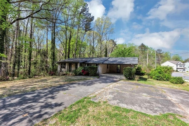9258 Westview Dr SW, Covington, GA 30014 - view of front of house featuring a carport and aphalt driveway