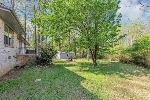 9258 Westview Dr SW, Covington, GA 30014 - view of yard with an outdoor structure and a storage shed