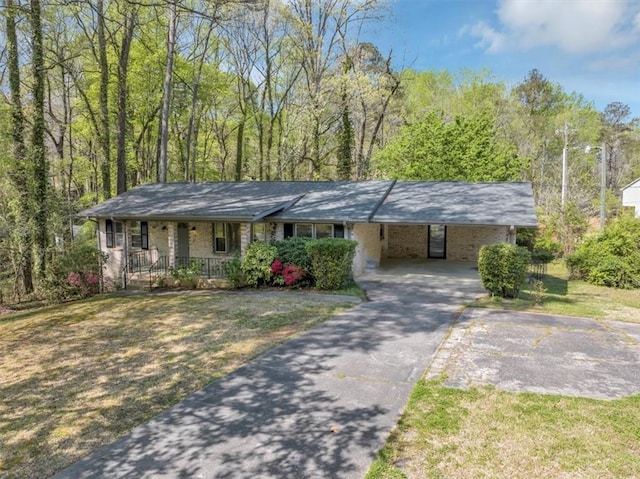 9258 Westview Dr SW, Covington, GA 30014 - ranch-style home with an attached carport, driveway, a porch, and a front yard
