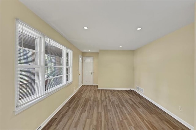 9258 Westview Dr SW, Covington, GA 30014 - spare room featuring recessed lighting, baseboards, visible vents, and wood finished floors