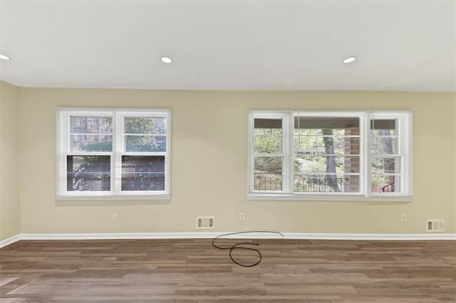 9258 Westview Dr SW, Covington, GA 30014 - spare room featuring wood finished floors, baseboards, and visible vents
