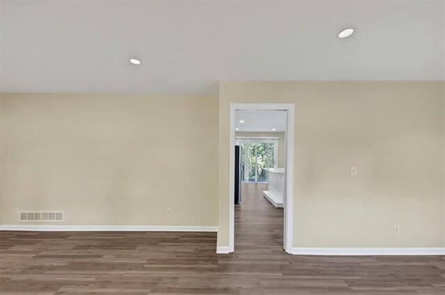 9258 Westview Dr SW, Covington, GA 30014 - spare room with wood finished floors, recessed lighting, baseboards, and visible vents