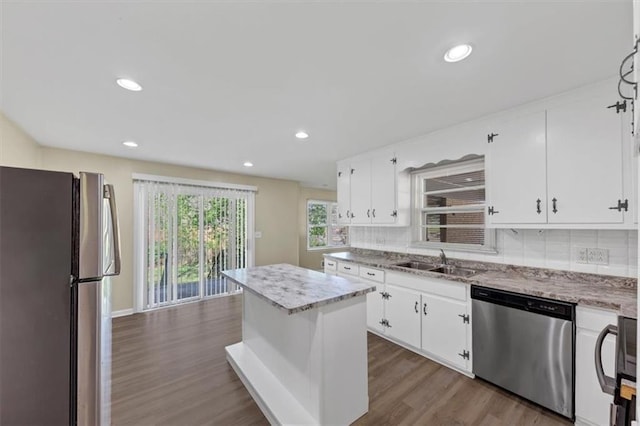 9258 Westview Dr SW, Covington, GA 30014 - kitchen with a sink, freestanding refrigerator, tasteful backsplash, dishwasher, and dark wood-type flooring