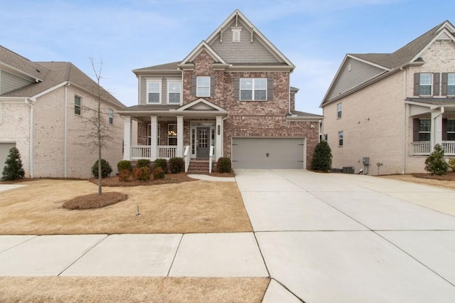 view of front of property with covered porch and a garage